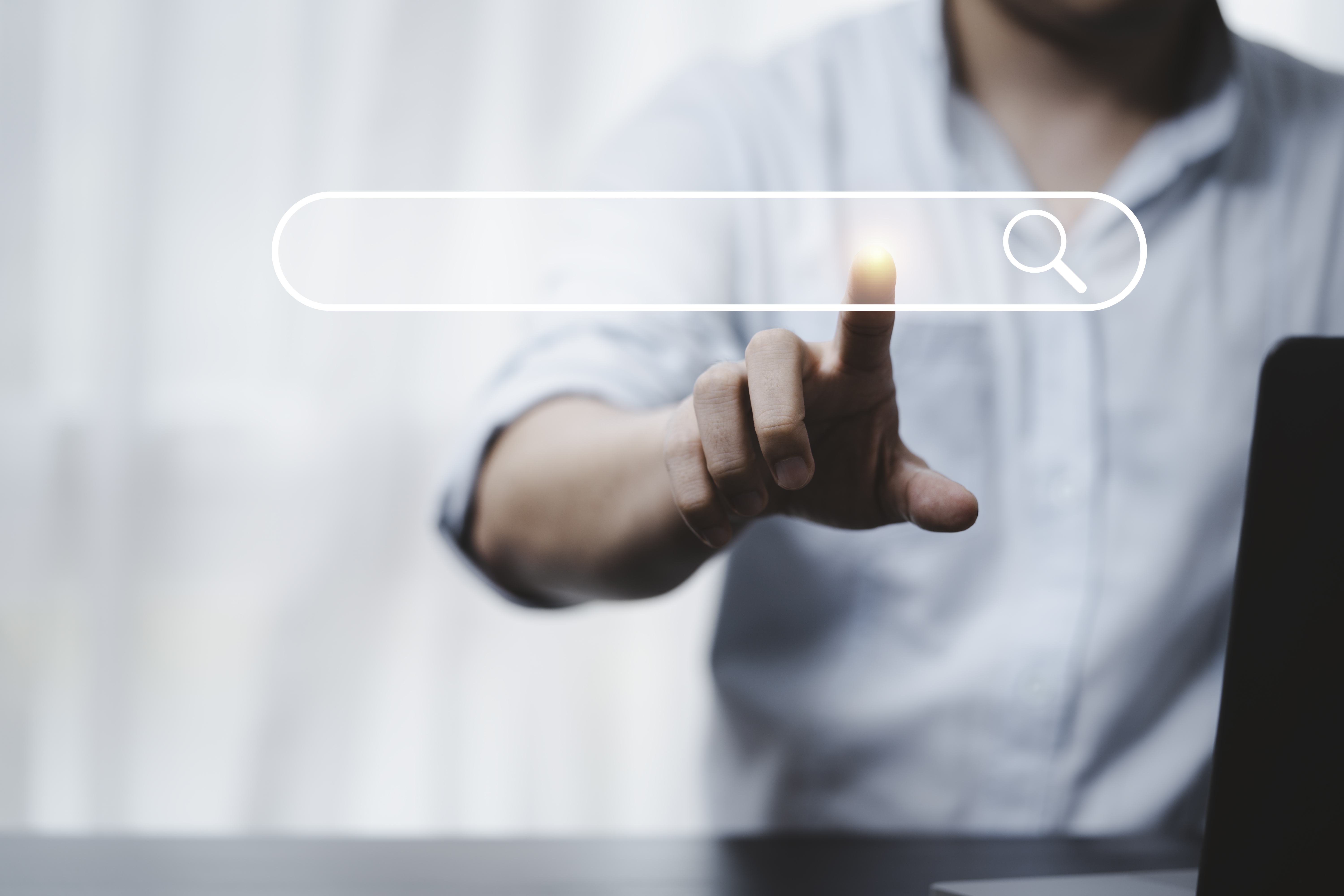 hand-touching-with-search-icon-search-engine-optimisation-seo-concept-find-information-by-internet-connection (1)
